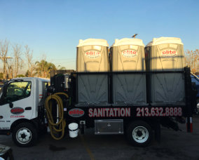 truck loaded with portable toilets